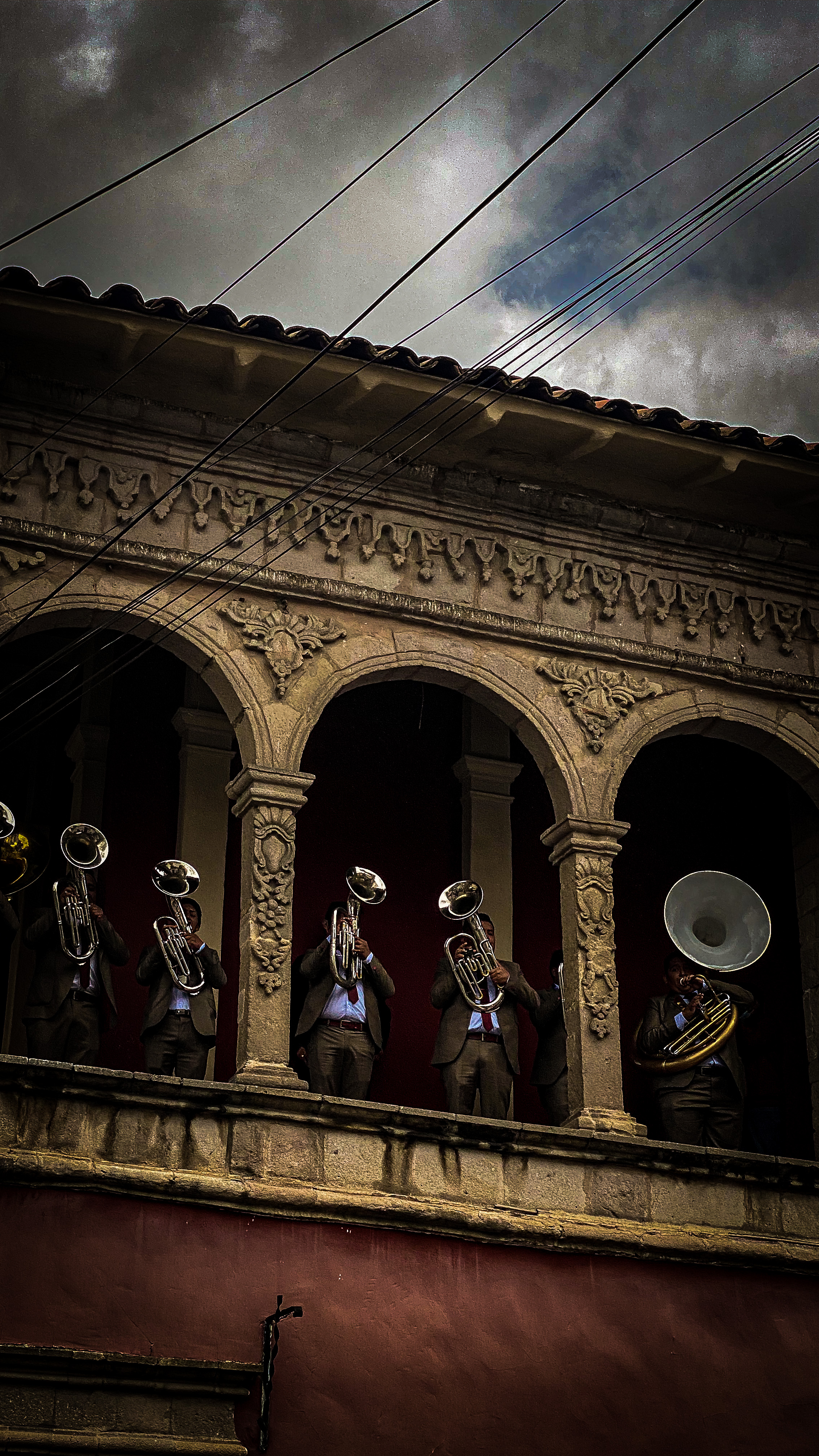 Brass band playing on a colonial balcony
